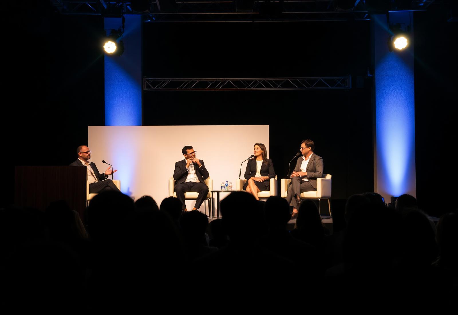 Corporate panel discussion on a modern stage